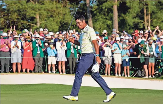  ?? PHOTOS BY ROB SCHUMACHER/ARIZONA REPUBLIC ?? Hideki Matsuyama celebrates on the 18th green after winning The Masters golf tournament.
