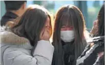  ??  ?? Tearful fans gather to visit the mourning altar for Kim Jong-Hyun, a 27-year-old lead singer of the massively popular K-pop boyband SHINee, at a hospital in Seoul yesterday.