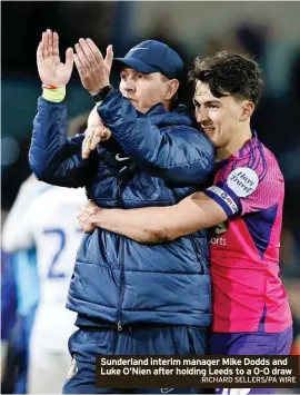  ?? RICHARD SELLERS/PA WIRE ?? Sunderland interim manager Mike Dodds and Luke O’nien after holding Leeds to a 0-0 draw