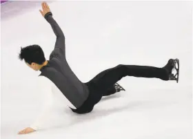  ?? Bernat Armangue / Associated Press ?? Nathan Chen of the United States falls while performing in the men's short program Friday. Chen would have a brilliant free skate Saturday but did not medal, finishing fifth.