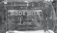  ?? Staff photo by Neil Abeles ?? ■ This glass ovenware with its “Made With Love” etching is one of Laura Littlejohn’s best sellers.