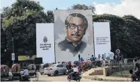  ?? PHOTO: GETTY IMAGES ?? A portrait of Sheikh Mujibur Rahman was installed at Dhaka University in 2018 to mark a National Mourning Day.