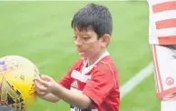  ??  ?? My ball Sudais had fun playing football before the match and met Hammy the Hamster (right)