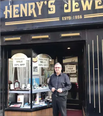  ??  ?? Tony Henry stands outside Henry’s Jewellers on High Street last week after he announced he would be closing the business in the next couple of weeks.