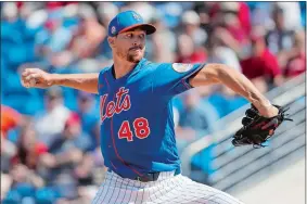  ?? JEFF ROBERSON/AP PHOTO ?? New York Mets pitcher Jacob deGrom throws during the first inning of a spring training game against the Washington Nationals on Sunday in Port St. Lucie, Fla.