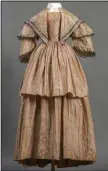  ?? (Special to the Democrat-Gazette/ Rett Peek) ?? Morning dress with overskirt and fichu, unknown maker, owned by Julia Mary Young Miller, silk, taffeta, bleached cotton, and polished cotton, ca. 1845, Memphis, or New England, 59-by-19 inches, collection of Historic Arkansas Museum, gift of Juliette Reed Wynn. This dress is part of “Conspicuou­s Consumptio­n: If You’ve Got It, Flaunt It” a new exhibit that opens Friday at Historic Arkansas Museum in Little Rock.