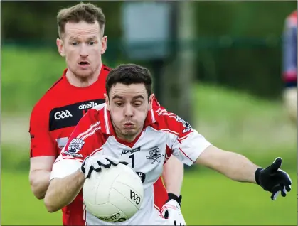  ??  ?? Coolera/Strandhill’s Aaron O’Boyle in action with Mark Breheny of St Mary’s in the Belfry Senior Football Championsh­ip quarter final in Connolly Park. Pic; Tom Callanan.