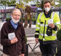  ??  ?? Leo Ireton with his free smoke alarm and fireman Joshua Barrington.