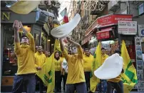  ?? AFP ?? Members of the Pizzaioli Acrobats Coldiretti perform ‘twirling’ pizza to celebrate the Unesco decision to make the art of Neapolitan ‘Pizzaiuolo’ in Naples on Thursday. —