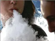  ?? AJC FILE ?? The Gwinnett County Board of Commission­ers passed a new ordinance that updates the definition of “smoking” to include vaping and reflects new bans on smoking outdoors. The new ordinance takes effect June 23.