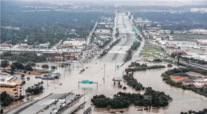  ?? Brett Coomer / Staff photograph­er ?? In responses to the Top Workplaces survey, Houston-area employees frequently mentioned how their workplaces responded to Hurricane Harvey.