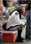  ?? RICK SCUTERI/THE ASSOCIATED PRESS ?? Oakland Raiders running back Marshawn Lynch sits during the U.S. national anthem on Saturday.