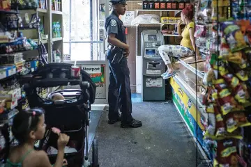  ??  ?? Camden Officer Rivera on patrol in the neighbourh­ood where he grew up.