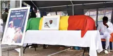  ??  ?? The coffin of the late Guinean singer Mory Kante is displayed during his funeral on Monday in Conakry Guinea.