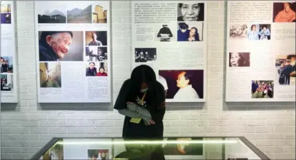  ?? XING YI / CHINA DAILY ?? A visitor views exhibits at the Chinese “Comfort Women” History Museum on Sept 18.
