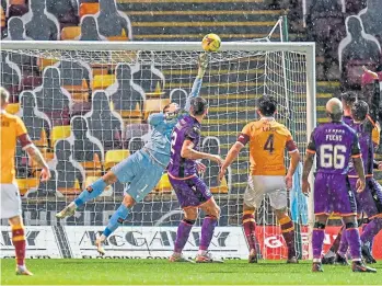  ??  ?? Benjamin Siegrist pulls off another fine save during the defeat at Fir Park.