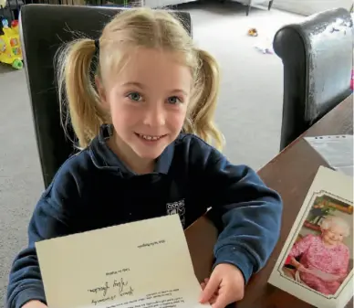  ?? PHOTO: JONATHAN LEASK/FAIRFAX NZ ?? Stella Bourgeois, 6, thought the Queen deserved a card for her 90th birthday but never expected to receive a response.