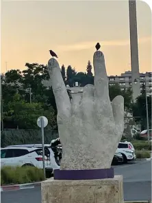  ?? (Dr. Yaacov Klein in Jerusalem) ?? THIS STATUE forms a hand sign often associated with certain subculture­s. While these two birds are unlikely part of it, there's no reason these feathered fellows can't rock out, too.