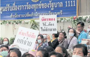  ?? CHANAT KATANYU ?? About 500 universal healthcare cardholder­s rally in Bangkok on Oct 6 after the NHSO terminated contacts with some clinics and hospitals over fraud allegation­s.
