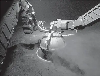  ?? OCEAN NETWORKS CANADA ?? A remotely operated vehicle installs a seismomete­r on the Juan de Fuca plate as part of Ocean Networks Canada’s Neptune project. Movement of the tectonic plate is gradually pushing Vancouver Island westward.