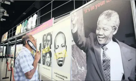  ??  ?? A visitor listens to a device describing the life and times of the Struggle stalwarts including Nelson Mandela at the ‘South Africa in the Making’ exhibition centre at Moses Mabhida Stadium. PICTURES: MOTSHWARI MOFOKENG/ANA