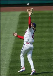  ?? LAURENCE KESTERSON — THE ASSOCIATED PRESS ?? Philadelph­ia Phillies third baseman Alec Bohm catches a fly during the first inning of a baseball game, Sunday in Philadelph­ia.