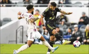  ?? JAE C. HONG/AP ?? Los Angeles FC forward Dénis Bouanga (right) shoots under pressure from Portland midfielder Eryk Williamson. Bouanga will be playing for Gabon during a Fifa-mandated break.