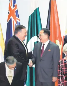  ??  ?? Pompeo shakes hands with Ri at the Asean Regional Forum in Singapore. — Reuters photo