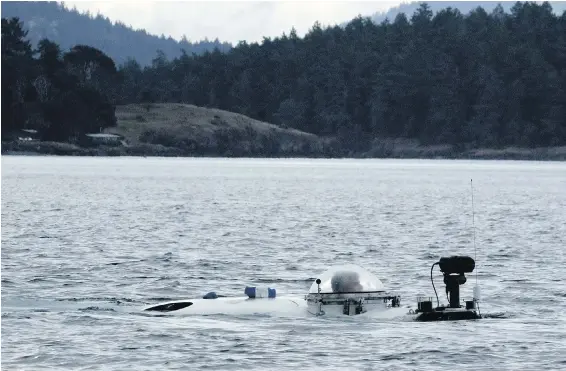  ??  ?? With pilot Stockton Rush in the dome, a submarine probing life deep in the Salish Sea surfaces off Point Caution in the San Juan Islands.