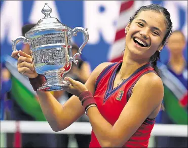  ?? Picture: Paul Zimmer via www.imago-images.de/imago/pa Images ?? Emma Raducanu lifts the women’s US Open trophy after an astounding three weeks in New York