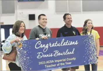  ?? ELIZABETH MAYORAL CORPUS PHOTO ?? Dennis Bourland (center right) was recognized as the 2023 ASCA Imperial County Teacher of the Year, on Friday, March 10, the Wilson Junior High School Gymnasium in El Centro.
