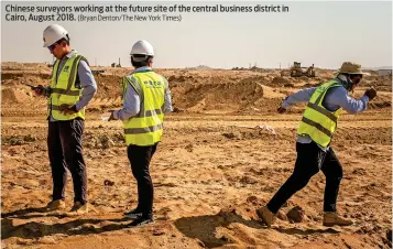  ?? (Bryan Denton/The New York Times) ?? Chinese surveyors working at the future site of the central business district in Cairo, August 2018.