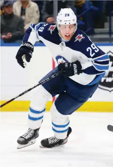 ?? JEFFREY T. BARNES/THE ASSOCIATED PRESS ?? Patrik Laine’s Winnipeg Jets are sputtering lately, Paul Friesen writes, and it’s obvious the team is not as cohesive a unit on the ice as they were last season.