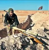  ?? — AFP ?? A fighter prepares defensive positions near Ayn alHisan, on the outskirts of West Mosul.