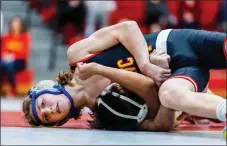  ?? NATE HECKENBERG­ER - FOR MEDIANEWS GROUP ?? West Chester East’s Zach McFarlane works on a headlock against West Chester Rustin’s Leo Flores at 107pounds.