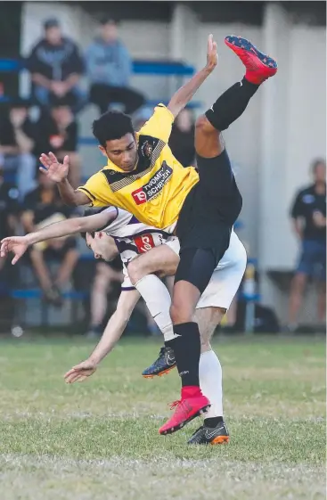  ?? Pictures: BRENDAN RADKE ?? IN A SPIN: Edge Hill Tigers’ Alex Mouladale cartwheels over Comets' Matthew Barnes in action from the FNQ Premier Men's match at Tiger Park, Manunda.