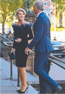  ??  ?? Julie Bishop and Neil Gillon arrive for the state funeral for Carla Zampatti in Sydney. Picture: NCA NewsWire