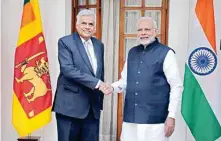  ??  ?? Prime Minister Narendra Modi shakes hands with Sri Lankan Prime Minister Ranil Wickremesi­nghe (L) prior to their meeting in New Delhi on Saturday. Wickremesi­nghe is on a two-day official visit to India to strengthen bilateral ties