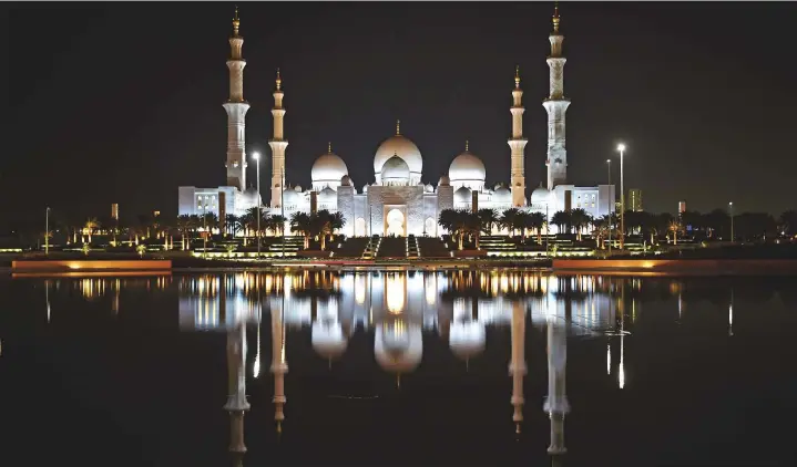  ?? Ahmed Kutty/Gulf News ?? Above: Shaikh Zayed Grand Mosque in Abu Dhabi as viewed from Wahat Al Karama at night.