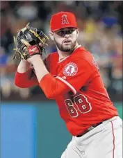  ?? Tony Gutierrez Associated Press By Andy McCullough and Pedro Moura ?? CAM BEDROSIAN seems to have the inside track to start the season as the closer for the Angels.