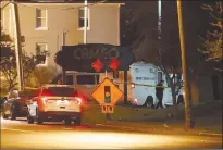  ?? Associated Press ?? Police operate at a crime scene outside the Cameo Nightclub after a reported fatal shooting on Sunday, in Cincinnati. At least two people opened fire inside a crowded nightclub early Sunday morning.