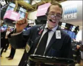  ?? RICHARD DREW — THE ASSOCIATED PRESS ?? Trader Gregory Rowe works on the floor of the New York Stock Exchange on Thursday.