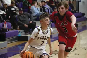  ?? The Sentinel-Record/Krishnan Collins ?? ■ Fountain Lake’s Nathan Topf (3) drives past Cutter Morning Star’s Daughtry Hackelton (3) Wednesday night.