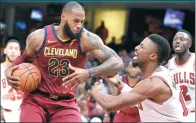  ?? DAVID RICHARD / USA TODAY SPORTS ?? Cleveland Cavaliers forward LeBron James drives against Chicago Bulls guard David Nwaba in the fourth quarter at Quicken Loans Arena in Cleveland on Tuesday.