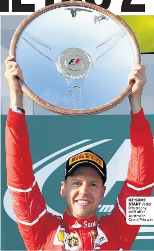  ??  ?? OZ-SOME START Vettel lifts trophy aloft after Australian Grand Prix win