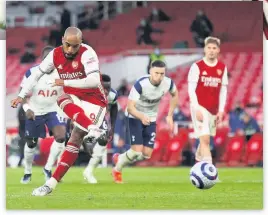  ??  ?? TOP GUNNS Odegaard celebrates equaliser, above, and Lacazette hits winner from the spot, left