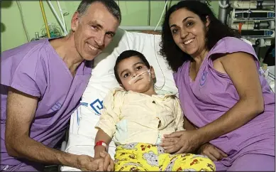  ??  ?? Ashya King with parents Brett and Naghmeh after receiving treatment in the Czech Republic