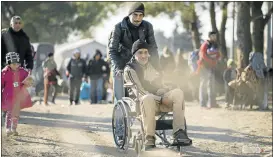  ?? Picture: AFP PHOTO ?? YOUNG AND OLD: Refugees cross the Greek-Macedonian border near Gevgelija this week. Migration will be among the issues on the agenda when Group of 20 leaders meet in Turkey this weekend.