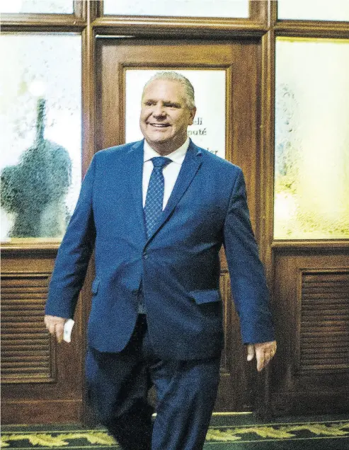  ?? ERNEST DOROSZUK / POSTMEDIA NEWS ?? Doug Ford, the new leader of the PC Party of Ontario, leaves the PC Party offices Monday after a brief visit to the legislatur­e in Queen’s Park in Toronto.