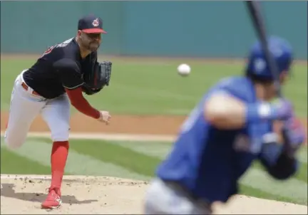  ?? TONY DEJAK — THE ASSOCIATED PRESS ?? Corey Kluber delivers to the Blue Jays’ Josh Donaldson in the first inning July 23 at Progressiv­e Field.